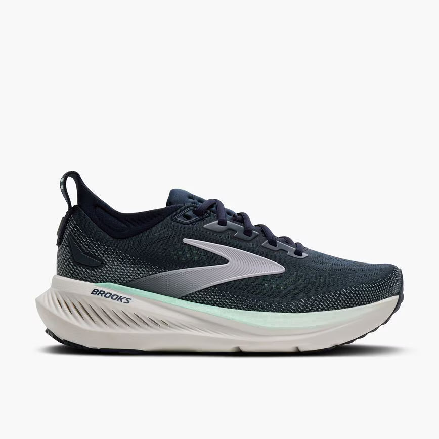 Navy running shoe with white sole on a light gray background