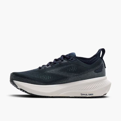 Navy running shoe with white sole on a white background
