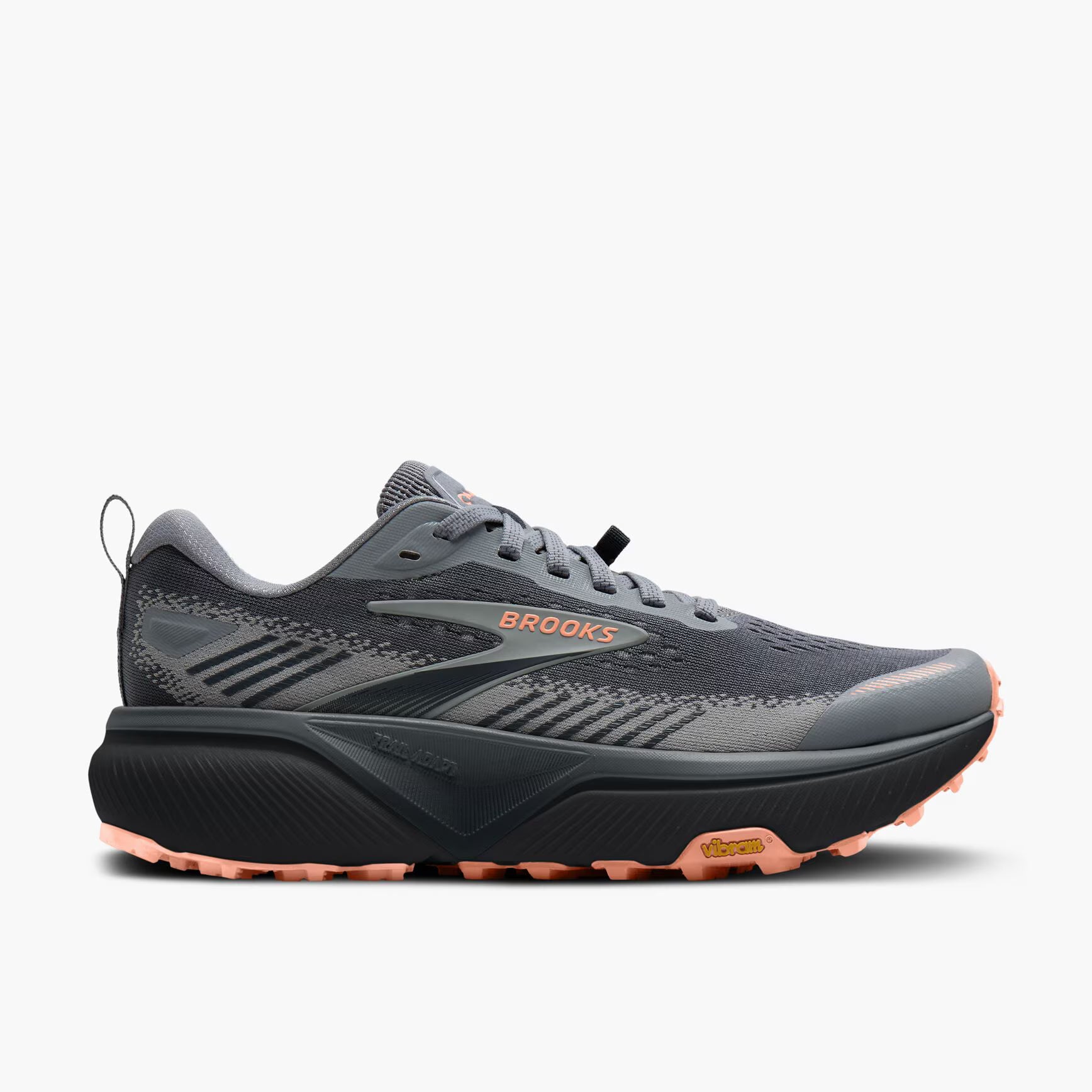 A Brooks running shoe in dark gray and black with vibrant orange accents on the logo, outsole, and heel, shown from a side profile on a light gray background.