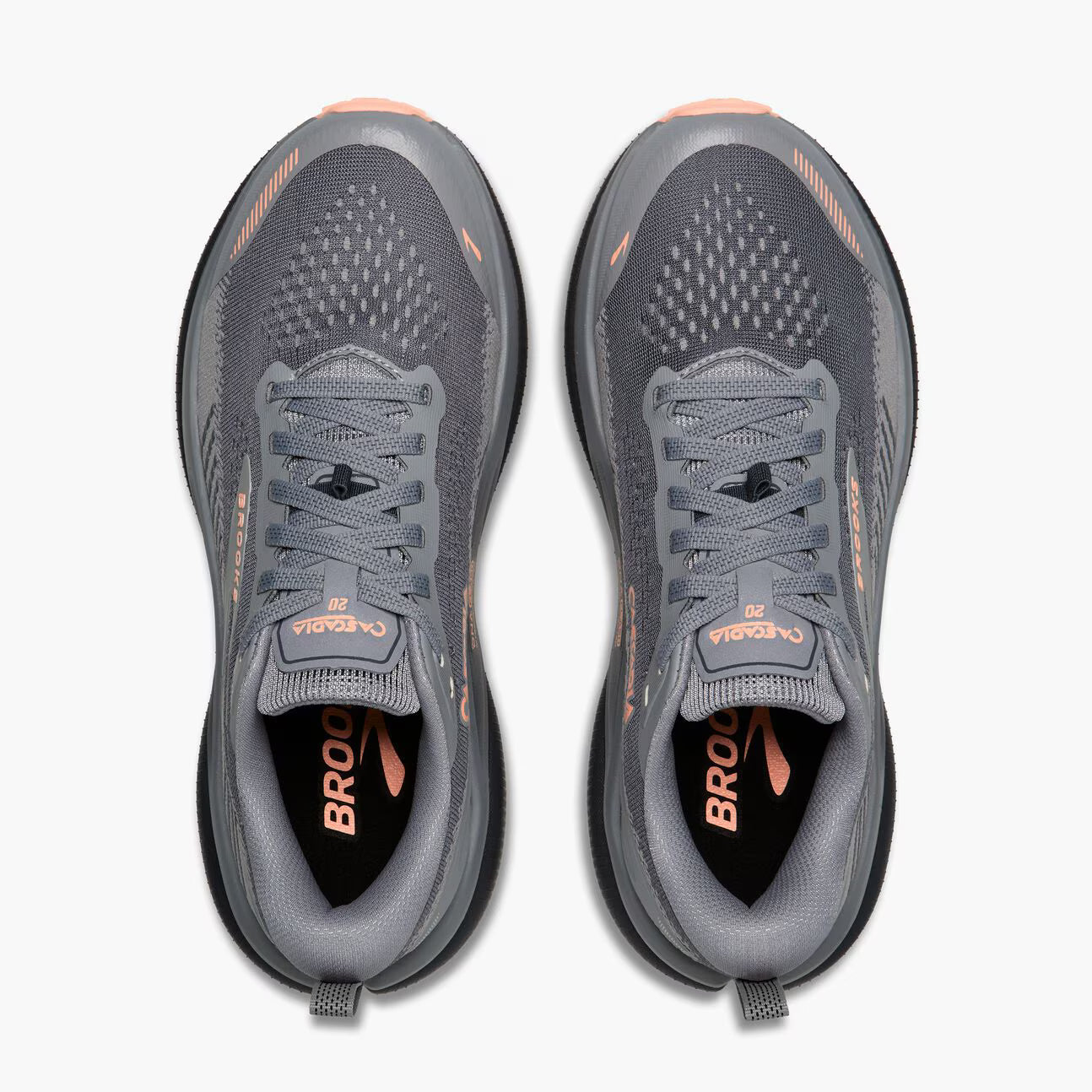 A pair of Brooks running shoes shown from a top-down view, featuring a dark gray mesh upper with peach accents and a black midsole.
