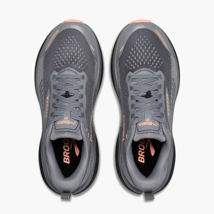 A pair of Brooks running shoes shown from a top-down view, featuring a dark gray mesh upper with peach accents and a black midsole.