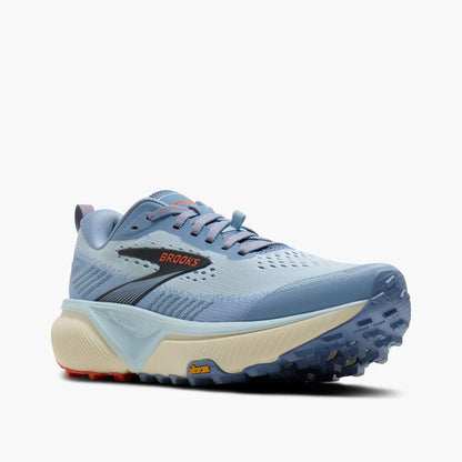 A light blue Brooks Cascadia 20 running shoe with a cream midsole, dark gray side stripe, and orange Brooks logo, shown from a side profile on a light gray background.