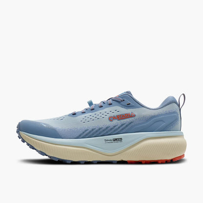 A light blue and white Brooks Cascadia 20 trail running shoe with a beige midsole and small red accents, shown from the side against a light gray background.