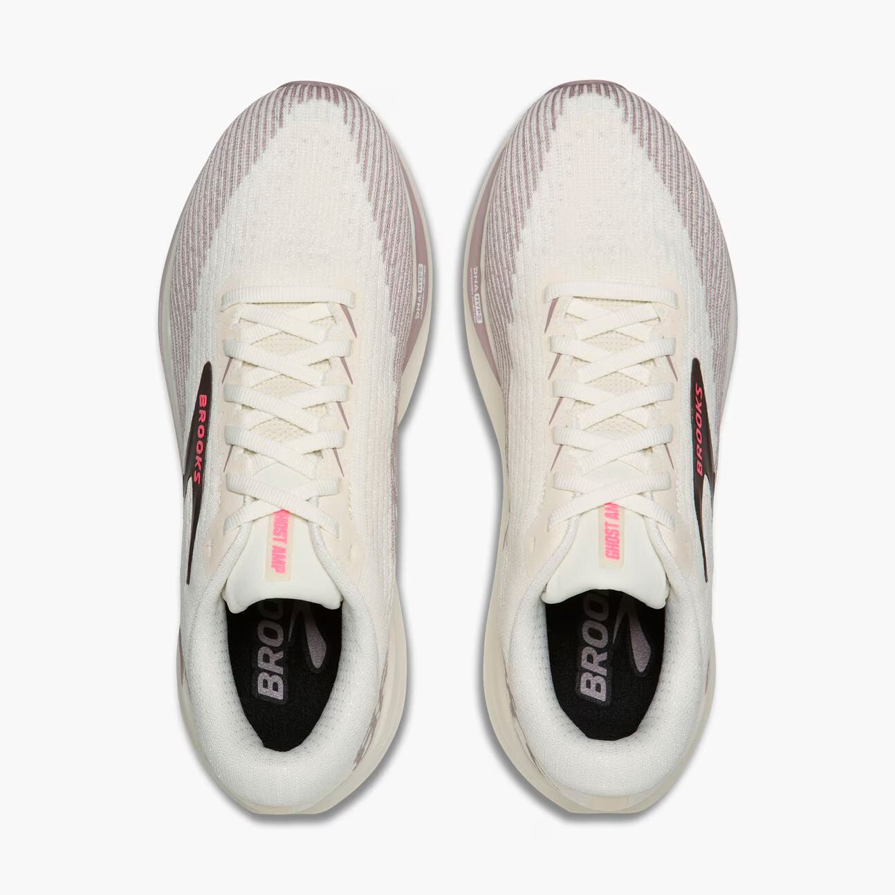 A pair of Brooks running shoes shown from a top-down view on a solid white background. The shoes feature a textured knit upper in off-white and light gray, white laces, a black inner lining with the brand name 'BROOKS' in white, and small pink accents on the tongue and heel.
