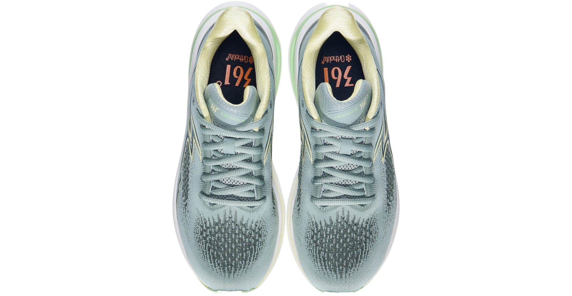 Pair of silver sneakers with a white sole on a white background