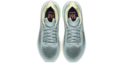 Pair of silver sneakers with a white sole on a white background