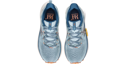 Pair of blue running shoes with visible brand logo on a white background
