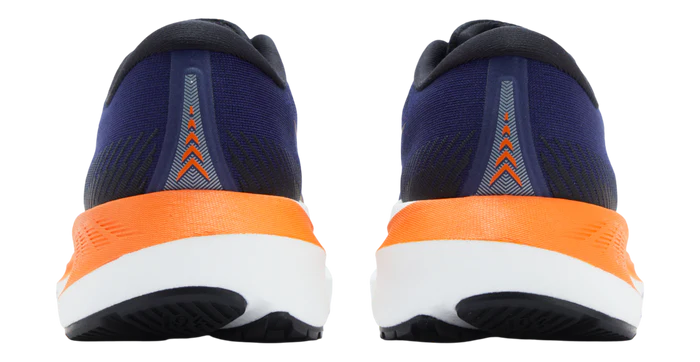 Navy and orange running shoes shown from the back on a white background
