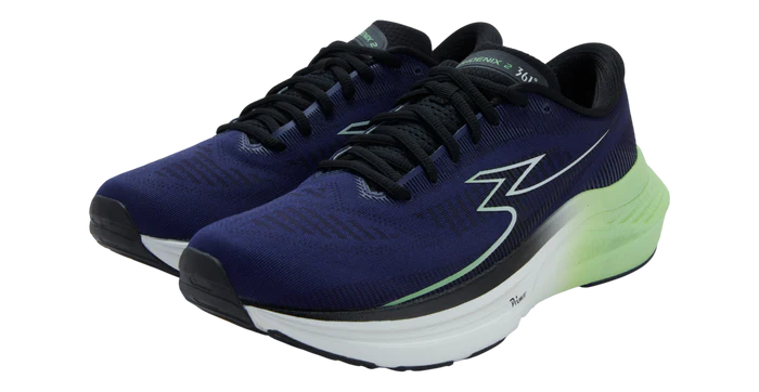 Pair of blue running shoes with a white sole on a white background