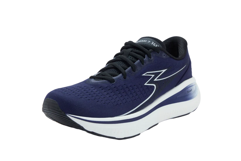 Navy running shoe with white sole on a white background