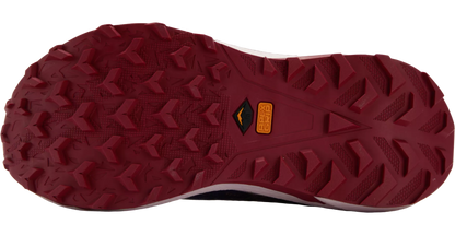Close-up of a red hiking shoe sole with tread pattern on a white background
