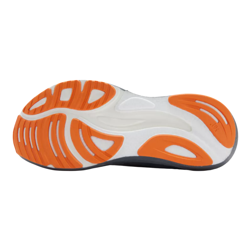 Close-up of a shoe sole with orange and white design on a white background