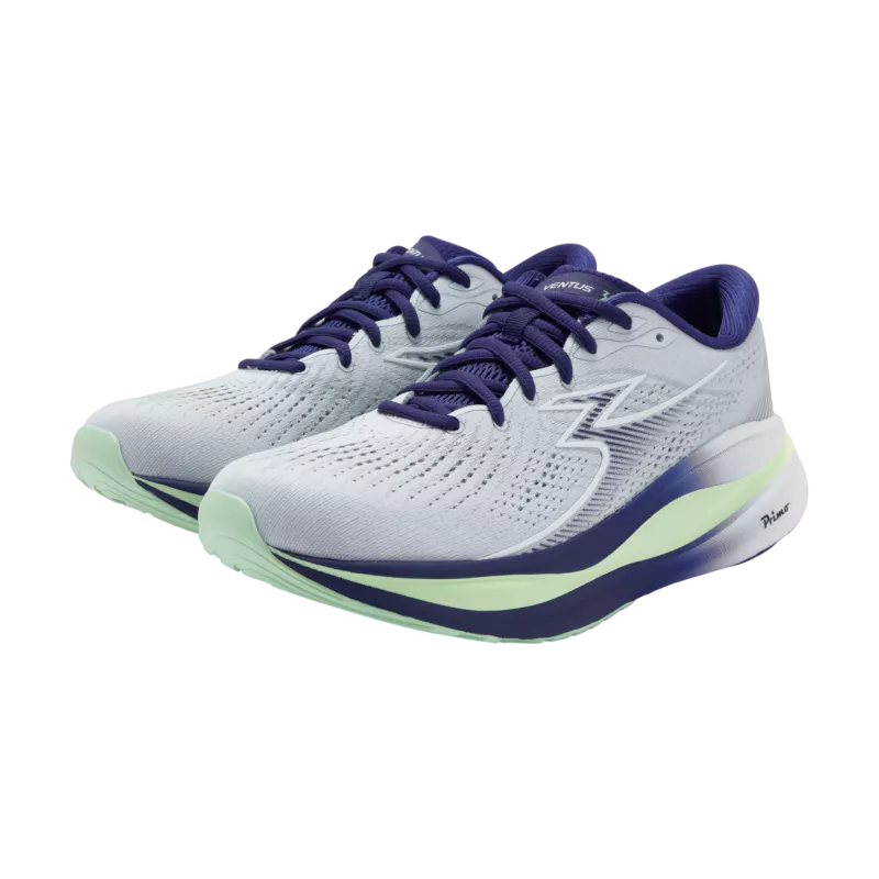 White running shoes with blue and green accents on a white background