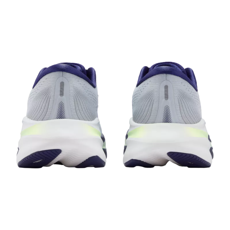 Pair of gray running shoes with purple and green accents on a white background