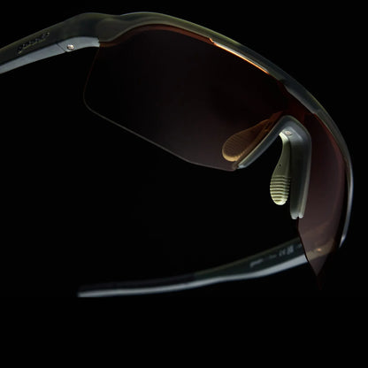 Goodr Bolt G The Jungle Is My Gym wraparound Sunglasses with a reflective lens on a black background