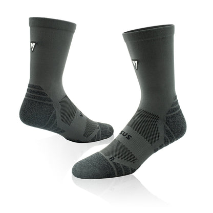 A pair of dark gray athletic crew socks with textured knit patterns and a small white logo on the side, displayed on a clean white background with a soft reflection.