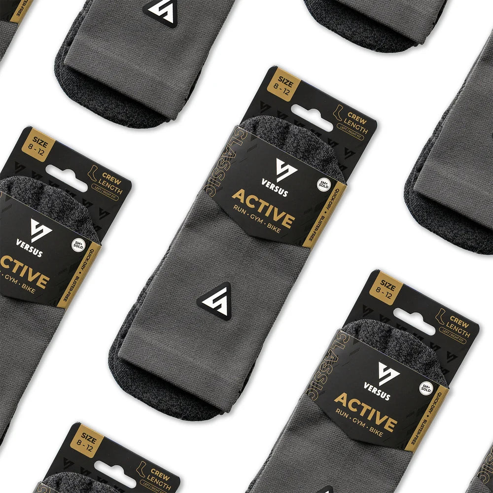Gray socks with 'Versus' packaging on a white background