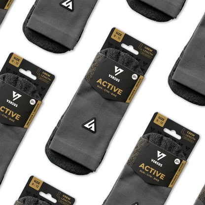 Gray socks with 'Versus' packaging on a white background