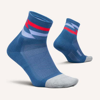 Pair of Feetures Elite Light Cushion Quarter Blue socks with red and gray accents on a light gray background