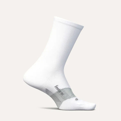 White socks with gray heel and toe area on a light gray background