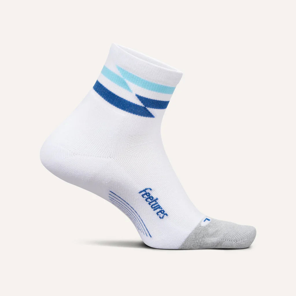 White sock with blue accents and 'Feetures' branding on a white background