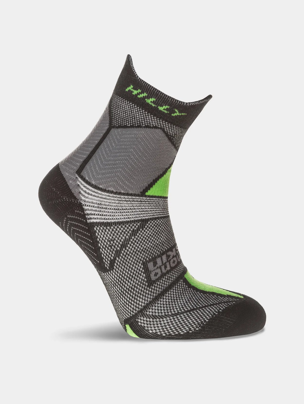 Black and gray sock with green accents on a light gray background