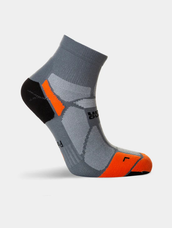 Gray and orange sock on a light gray background