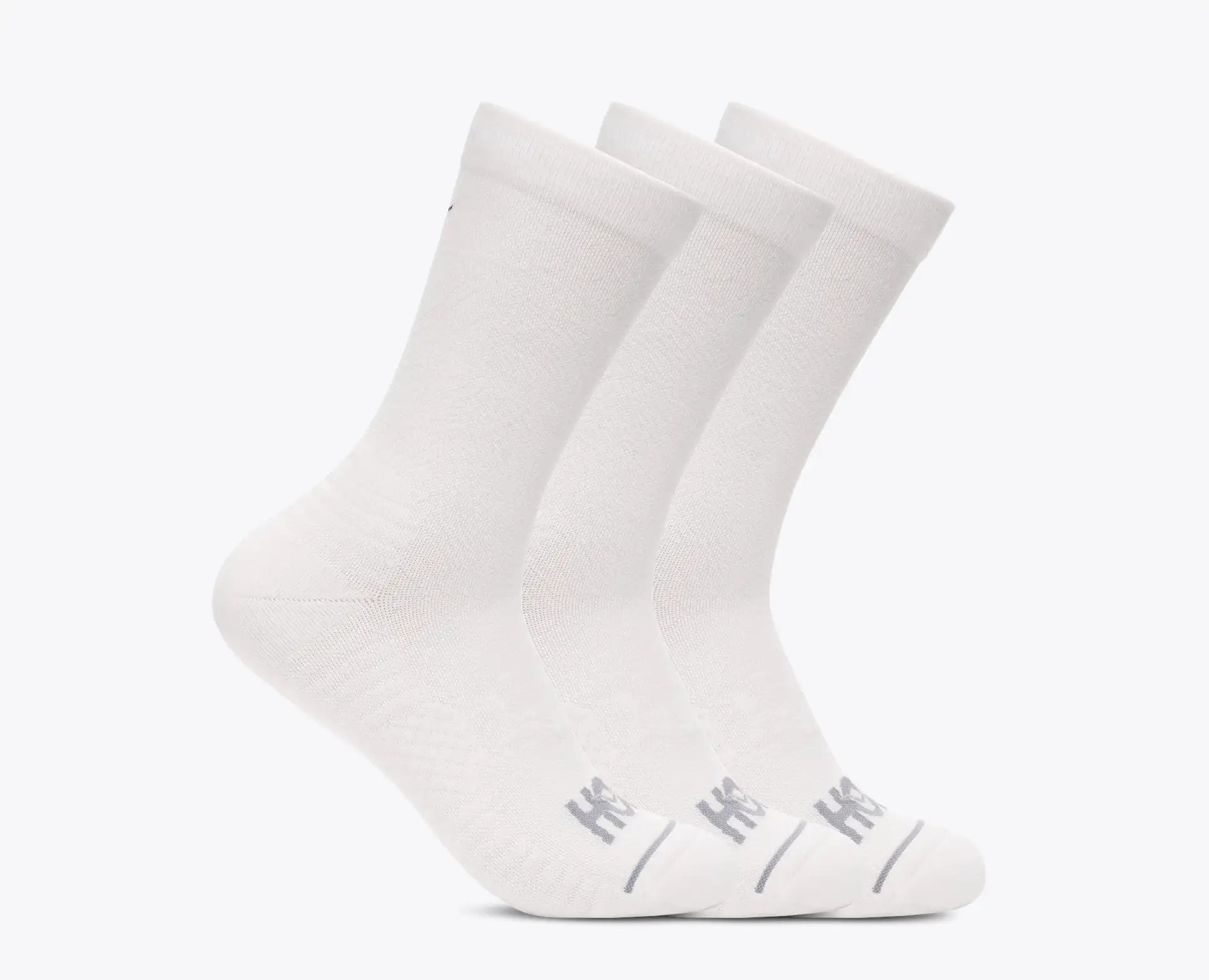 Three white socks with a brand logo on a light gray background