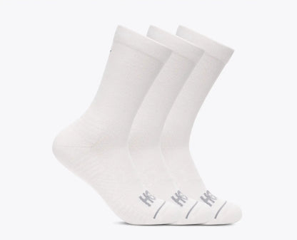 Three white socks with a brand logo on a light gray background