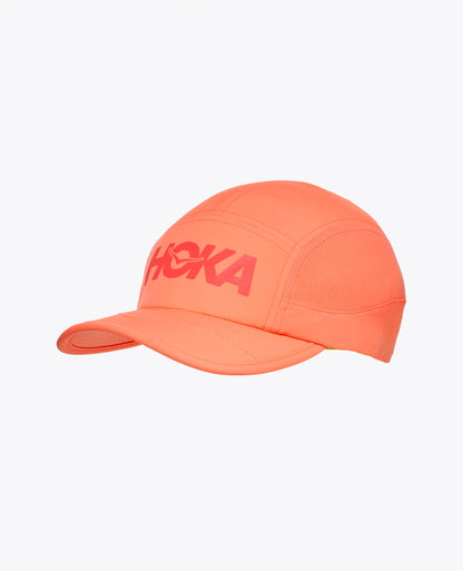 Neon Cantaloupe cap with 'Hoka' logo on a white background