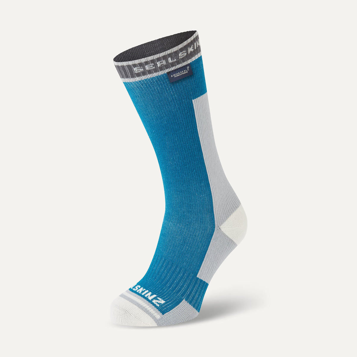 A single crew-length athletic sock in bright blue with white and gray panels, shown on a light gray background. The top cuff has a dark gray band with white 'SEALSKINZ' text, and the foot has a white 'SKIN Z' logo near the toe.