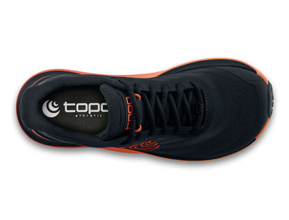 Black athletic shoe with orange accents on a white background