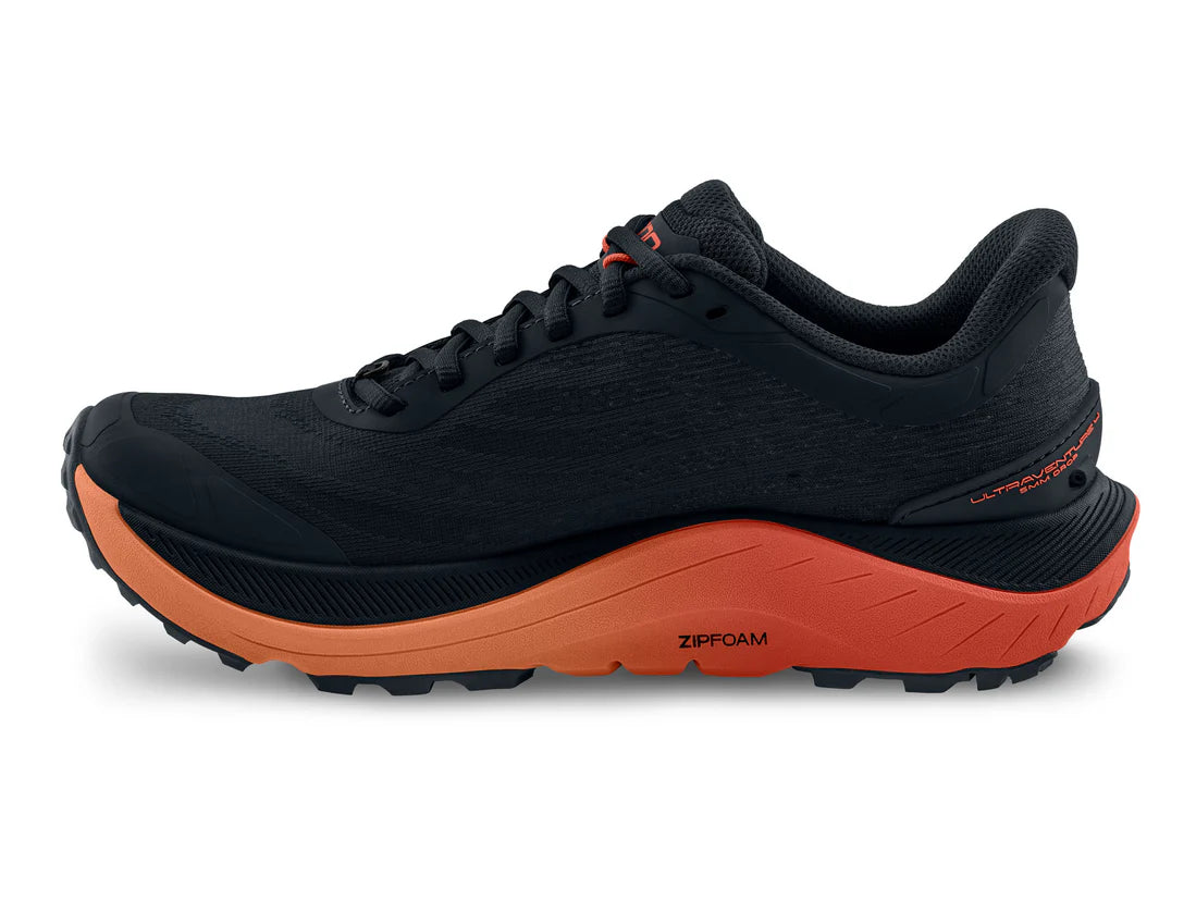 Black and orange running shoe on a white background