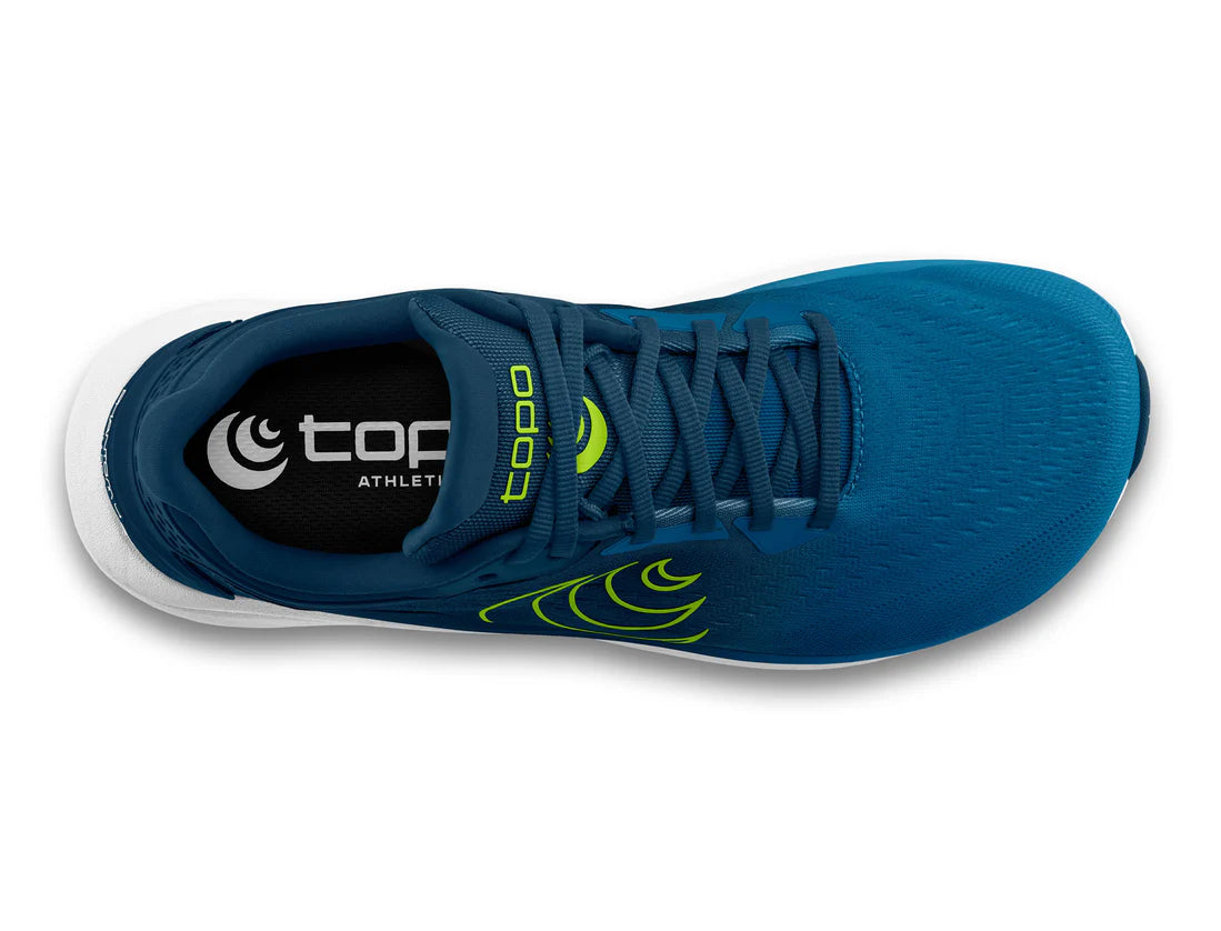 Blue athletic shoe with green accents on a white background