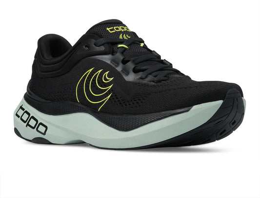 A single topo running shoe in black with a light green midsole and neon yellow logo accents, shown from a three-quarters angle on a white background.