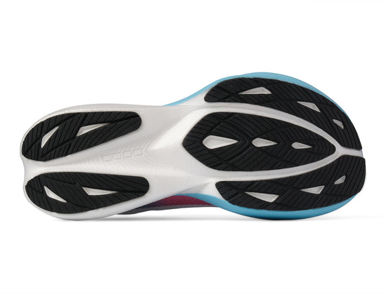 Close-up of a Topo Specter 3 running shoe sole with black and white design on a white background