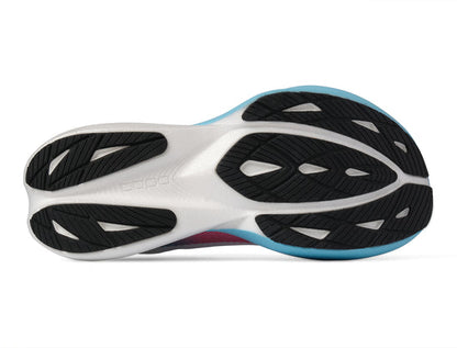 Close-up of a Topo Specter 3 running shoe sole with black and white design on a white background