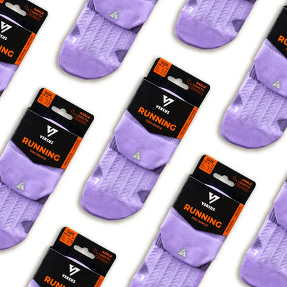 Purple running socks with Versus packaging on a white background