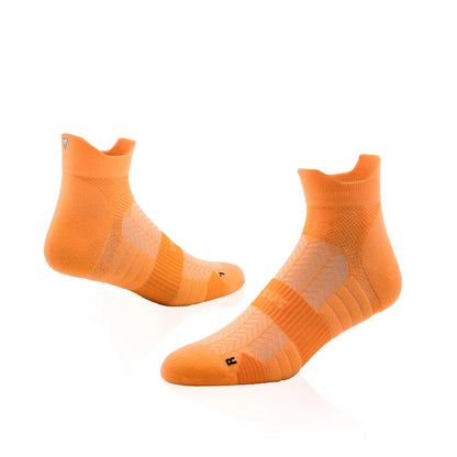 Pair of orange socks on a white background