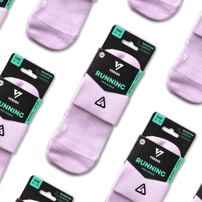 Three pairs of Versus Running quarter-length athletic socks in a light lavender purple color, packaged on black and teal cardboard hangers and arranged diagonally on a white background.