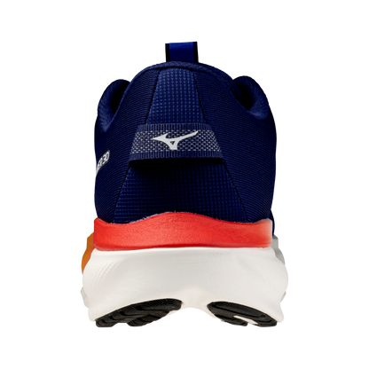 Rear view of a Mizuno running shoe in navy blue, featuring a white logo on the heel, a bright red midsole accent, and a white and black outsole.