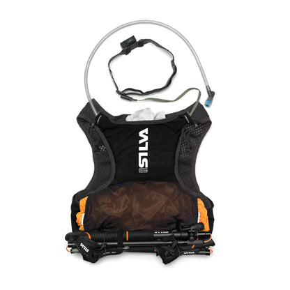 Silva hydration vest with water bottle and trekking poles on a white background
