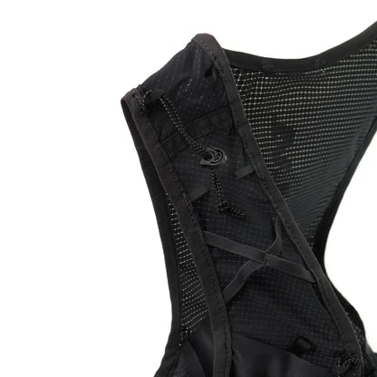 Black running vest with mesh back on a white background