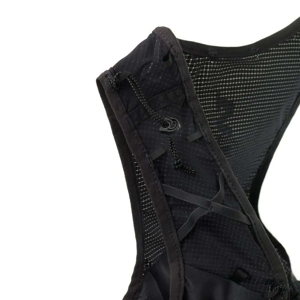 Black running vest with mesh back on a white background