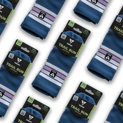 Blue socks with striped patterns and 'Versus' branding on packaging against a white background.