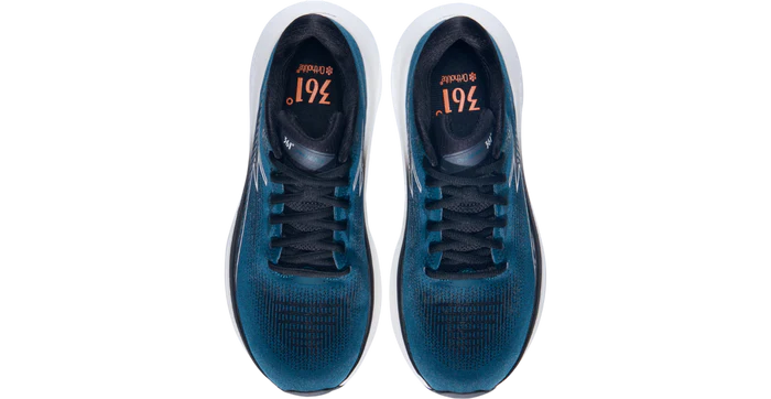 Pair of blue athletic shoes with white soles on a white background