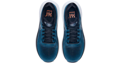 Pair of blue athletic shoes with white soles on a white background
