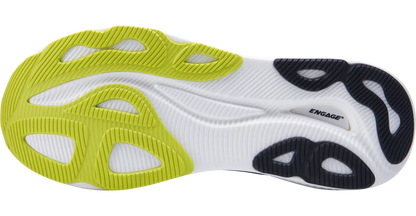 Close-up of a shoe sole with green, white, and black design on a white background