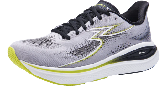 Gray running shoe with black and green accents on a white background