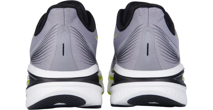 Gray running shoes with black and white sole on a white background